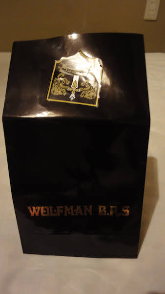 a small paper bag with the logo